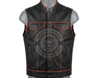 May include: A black leather vest featuring a mandarin collar, two chest pockets with flaps, and two vertical side pockets. The garment is accented with orange piping along the seams and edges, and includes an orange and black plaid interior lining.