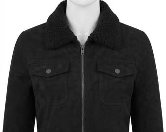 May include: A black jacket with a textured black sherpa collar, a full-length front zipper, and two chest pockets with button-down flaps. The garment features a matte finish and long sleeves, providing a structured look with a soft collar.