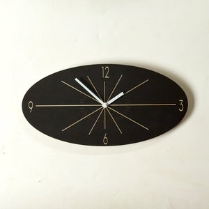 Black Oval Classic Wooden Wall Clock. Unique mid century modern silent analog clock for the kitchen, living room or bedroom.