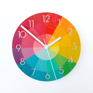 Rainbow Color Swatch Wooden Wall Clock With Numbers. Unique colourful modern silent analog clock for the kitchen, living room or bedroom.