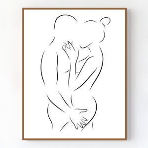 May include: A minimalist line art print depicting two figures embracing. The black lines on a white background create a sense of intimacy and connection. The artwork is framed in a brown wooden frame.