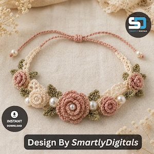May include: A crochet bracelet featuring dusty pink and cream-colored flowers, green leaves, and white faux pearls. The adjustable band is made of thin pink cord with small pearl accents at the ends. The image includes the text "INSTANT DOWNLOAD" and "Design By SmartlyDigitals".