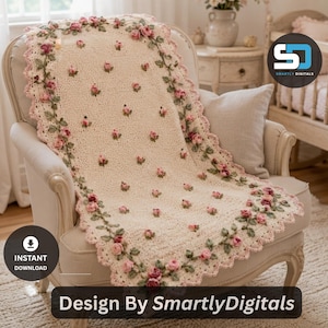 May include: A cream-colored crocheted blanket featuring a scalloped edge and a repeating pattern of small pink rosebuds with green leaves. The blanket is draped over a chair and includes the text Design By SmartlyDigitals.