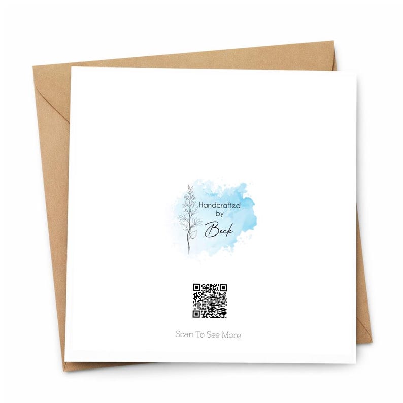 May include: A white greeting card with a watercolor blue and teal background, a floral design, and the text "Handcrafted by Beek." A QR code and the text "Scan To See More" are also present. The card is inside a brown envelope.