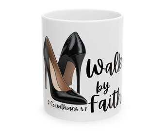 May include: White ceramic mug featuring a pair of black high-heeled shoes. The words "Walk by Faith" are written in black script, along with the Bible verse 2 Corinthians 5:7.