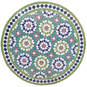 May include: Round mosaic tile table top with a detailed geometric pattern. The design features a central arrangement of stars and floral motifs in shades of blue, green, pink, and white. The border is a mix of green and blue diamond shapes.