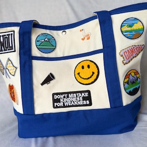 May include: A set of three ceramic mugs with a speckled, matte finish. The mugs are in shades of cream, light gray, and dark gray. Each mug has a simple, minimalist design, perfect for coffee or tea.