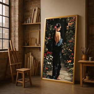May include: A framed art print featuring a woman in a black kimono with floral accents, standing in a garden path. The artwork has a gold frame and is displayed in a studio setting with an easel, stool, and brick wall.