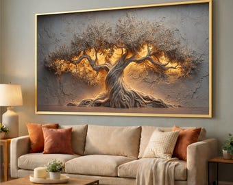 May include: A framed wall art piece featuring a textured, three-dimensional olive tree design. The tree has a gnarled trunk and branches with illuminated foliage, set against a gray background. The frame is gold, and the artwork hangs above a beige sofa.