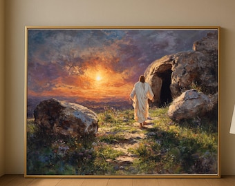 May include: A framed painting depicts a figure in white robes walking towards a cave entrance. The artwork features a vibrant sunset with orange and yellow hues. Large rocks and green vegetation frame the path, creating a serene landscape.