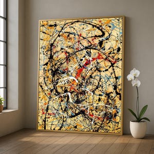 Könnte beinhalten: Abstraktes expressionistisches Gemälde mit goldenem Rahmen. Das Kunstwerk zeigt einen beigen Hintergrund mit Spritzern und Linien aus schwarzer, weißer, roter und blauer Farbe. Das Gemälde wird in einem Raum mit Fenster und Topf-Orchidee ausgestellt.