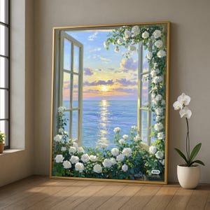 May include: A framed painting shows an open window with a sea view at sunset. White roses and foliage adorn the window frame. The painting has a gold frame and is propped against a wall. A potted orchid is to the right.