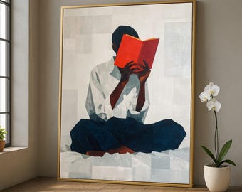 May include: A framed art print showing a person reading a book. The person is wearing a white shirt and dark blue trousers. The book is open, with bright red pages. The background has a light, abstract pattern.