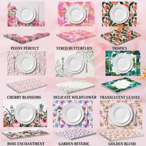 May include: A collection of placemats with floral and butterfly designs. Each placemat features a white plate, fork, and knife. Text on the placemats includes "Peony Perfect", "Vered Butterflies", "Tropics", "Cherry Blossoms", "Delicate Wildflower", "Translucent Leaves", "Rose Enchantment", "Garden Reverie", and "Golden Blush".