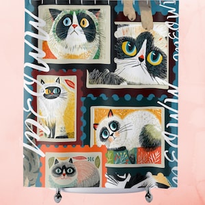 May include: A shower curtain featuring a collage of illustrated cats in postage stamp frames. The cats have various fur patterns and eye colors, set against a teal background with the word "Meow" in white script.
