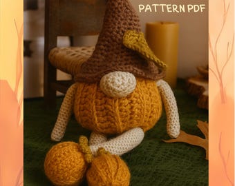 May include: A handmade crochet gnome doll with a pumpkin-shaped body, brown hat, and cream-colored arms and legs. The doll has two orange pumpkin-shaped feet. The text "PATTERN PDF" is visible in the image.