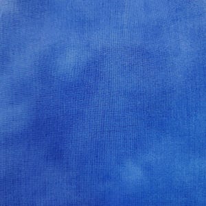 May include: A close-up shot of a vibrant blue fabric with a textured surface. The color is a solid, saturated blue with subtle variations in tone, creating a visual depth. The fabric appears to be tightly woven, suggesting a durable material.