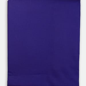 May include: A folded, solid-colored fabric in a deep shade of purple. The fabric appears to be smooth and has a slight sheen. The edges are neatly folded, suggesting a finished product, possibly a sheet or tablecloth.