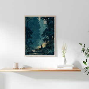 May include: A framed art print showing a forest scene with a black cat silhouette on a stone path. The artwork uses blues and greens, with light filtering through the trees. The print is displayed on a wooden shelf.