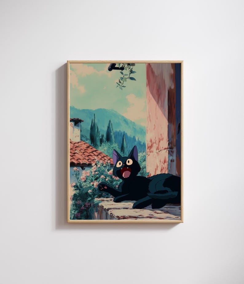 May include: A framed print featuring a black cat with wide eyes and an open mouth, set against a backdrop of a scenic Italian landscape. The artwork showcases a terracotta roof, lush greenery, and distant mountains under a blue sky.