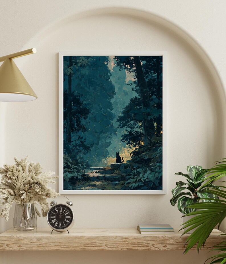 May include: A framed art print showing a forest scene in blue and green hues. A black cat silhouette is perched on stone steps, bathed in soft light. The artwork is displayed on a wooden shelf with a clock and a vase of dried flowers.
