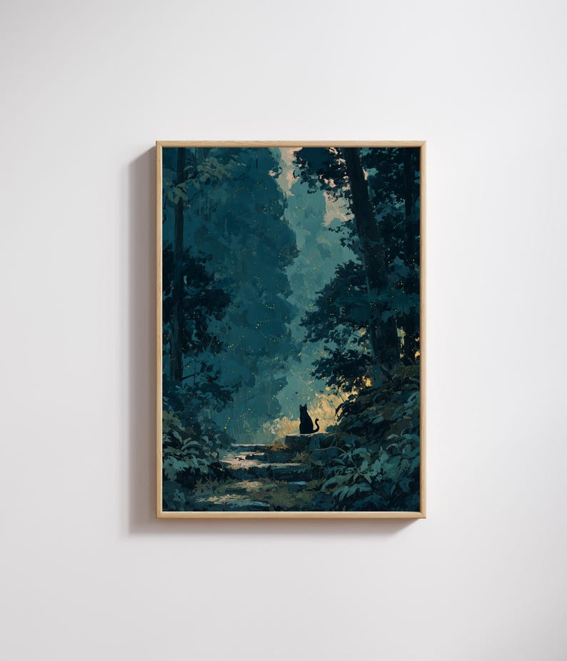 May include: A framed art print of a forest scene. The artwork shows a pathway leading into a dark green forest, with a black cat silhouette on a stone step. The print is in a light brown wooden frame. The forest is a deep teal colour.
