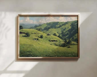May include: A framed landscape painting depicting rolling green hills under a bright sky with scattered clouds. The scene features small, earth-covered dwellings built into the grassy slopes, surrounded by trees and a soft, natural light.
