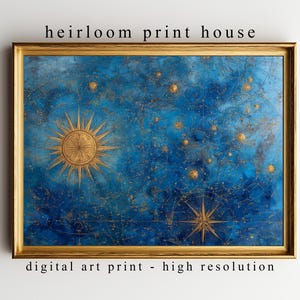 Puede incluir: Una impresión artística digital enmarcada con temática celestial. La obra presenta un fondo azul oscuro con detalles dorados que representan estrellas, constelaciones y diseños de rayos de sol. El marco es dorado, con el texto "heirloom print house" y "digital art print - high resolution".