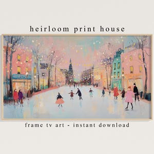 May include: A framed print depicting an ice skating scene in a European town. The artwork uses a pastel colour palette, with figures skating on a frozen street. The text "heirloom print house" and "frame tv art - instant download" are visible.