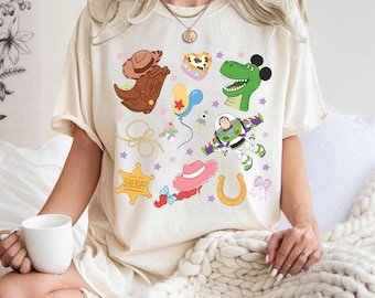 Retro Toy Story Comfort Color Shirt, Woody Buzz Jessie Tee, Pixar Character Badge Tee, Cute Disney Toy Shirt, Disney Family Trip 2026 Shirts