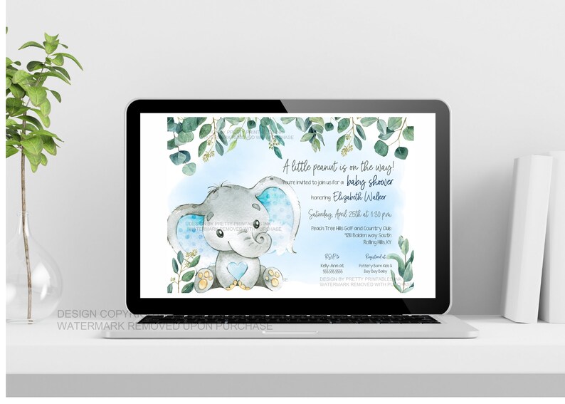 Blue elephant baby shower invitation shown on a laptop on top of white desk so you can see what the invitation looks like when sent as an e-vite.