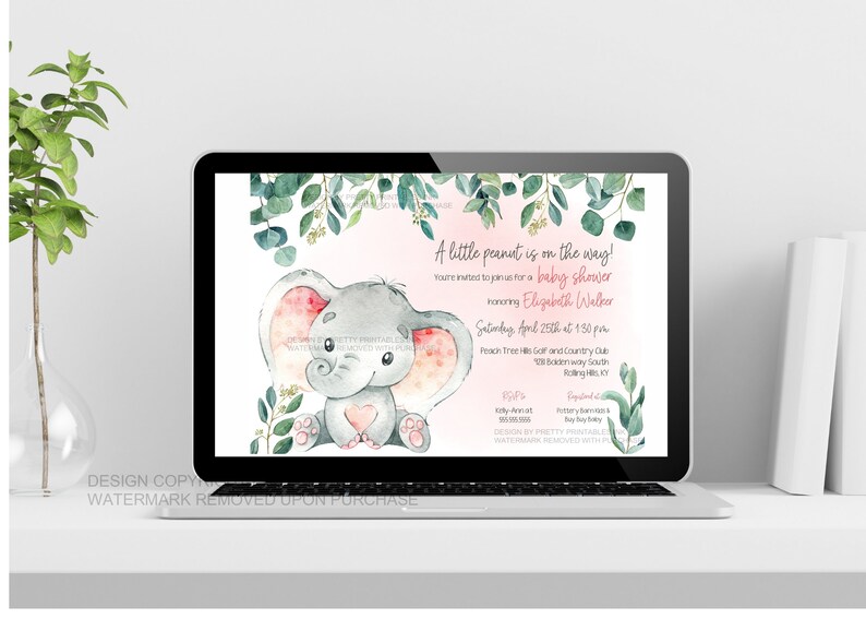 Pink elephant baby shower invitation shown on a laptop on top of a white desk so you can see what the invitation looks like when sent as an e-vite