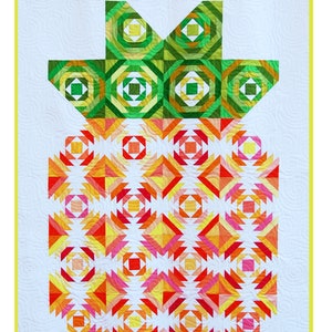May include: A quilt featuring a colorful pineapple design. The pineapple is composed of geometric shapes in shades of orange, yellow, and pink, with a green top. The quilt has a white background with a yellow border. The text "Pineapple2" and "Heather Kojan Quilts" are displayed.