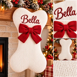 May include: A white bone-shaped Christmas stocking made of ribbed knit fabric. The stocking features the name Bella embroidered in red script lettering and is decorated with a large, textured red knit bow centered on the front.