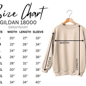 May include: A beige Gildan 18000 sweatshirt hangs on a wooden hanger. The image includes a size chart with measurements in inches for width, length, and sleeve length, ranging from size S to 5XL.