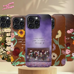 May include: A collection of phone cases with floral and wooden designs. One case features a sunflower, while another has the text "Long live the walls we crashed through." The cases are displayed on a wooden stand.