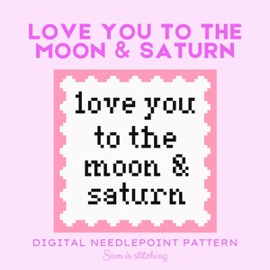 May include: A digital needlepoint pattern with the text "LOVE YOU TO THE MOON & SATURN". The design features pixelated text in black on a white background, framed by a pink border, set against a light pink backdrop.