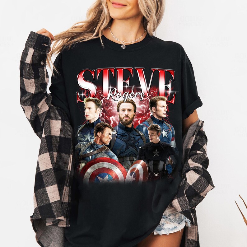 May include: Black long-sleeve t-shirt featuring a graphic of Steve Rogers, with the text "STEVE ROGERS" in red and white. The graphic includes multiple images of the character in various poses, with a red lightning background.