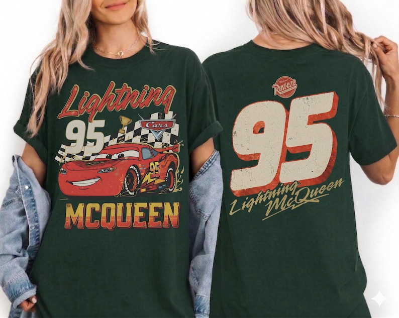 May include: Dark green t-shirt featuring a distressed graphic of Lightning McQueen race car with the number 95. The front of the shirt has the text "Lightning McQueen" and the back has the number 95 and "Lightning McQueen".