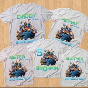May include: White t-shirts with colorful graphics and text for a birthday celebration. The shirts read "Daddy," "Mommy," "Sister," "Brother," and "5 Benjamin" with "Birthday Boy" on some. The graphic features cartoon characters.