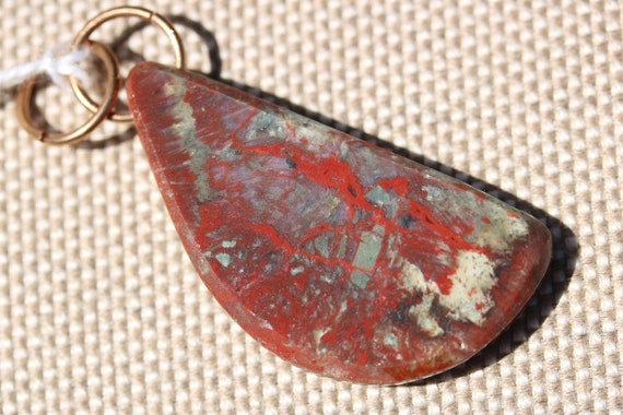Natural Coprolite Pendant brass twirl bail 31ct; Fossilized Dinosaur Dung green peach red-brown