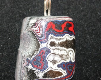 Fordite Pendant, black red gray, silver Coiled bail 25.5ct; Fordite is dried paint from the plant spray paint booth