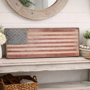 May include: A white ceramic mug with a black handle and the text "But First, Coffee" in a black, handwritten-style font. The mug is likely 11-15 ounces in size, perfect for a morning beverage.