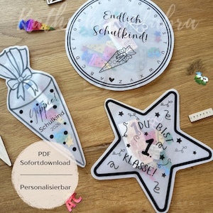 May include: A white ceramic mug with a black handle and the text "But First, Coffee" in a bold, black font. The mug is set against a blurred background, suggesting a cozy setting.