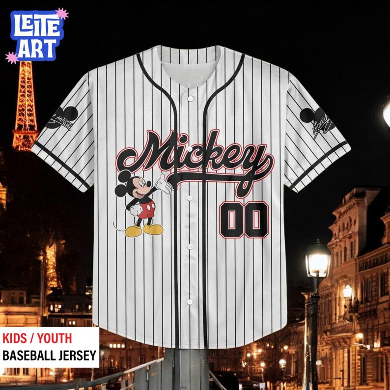 A Mickey Mouse baseball jersey with the number 00 displayed on it, hanging against a nighttime cityscape background.
