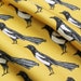 Yellow magpie upholstery fabric available by the metre 