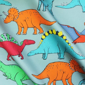 Dinosaur Multi Coloured upholstery fabric available by the metre