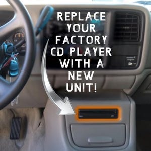 May include: Interior car shot with text that reads "REPLACE YOUR FACTORY CD PLAYER WITH A NEW UNIT!" A silver arrow points to a car CD player. The car's steering wheel and dashboard are visible.
