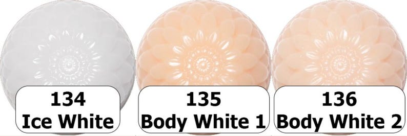 May include: Three spherical objects with a floral pattern, each with a different shade of white. The first is labeled "134 Ice White", the second "135 Body White 1", and the third "136 Body White 2".