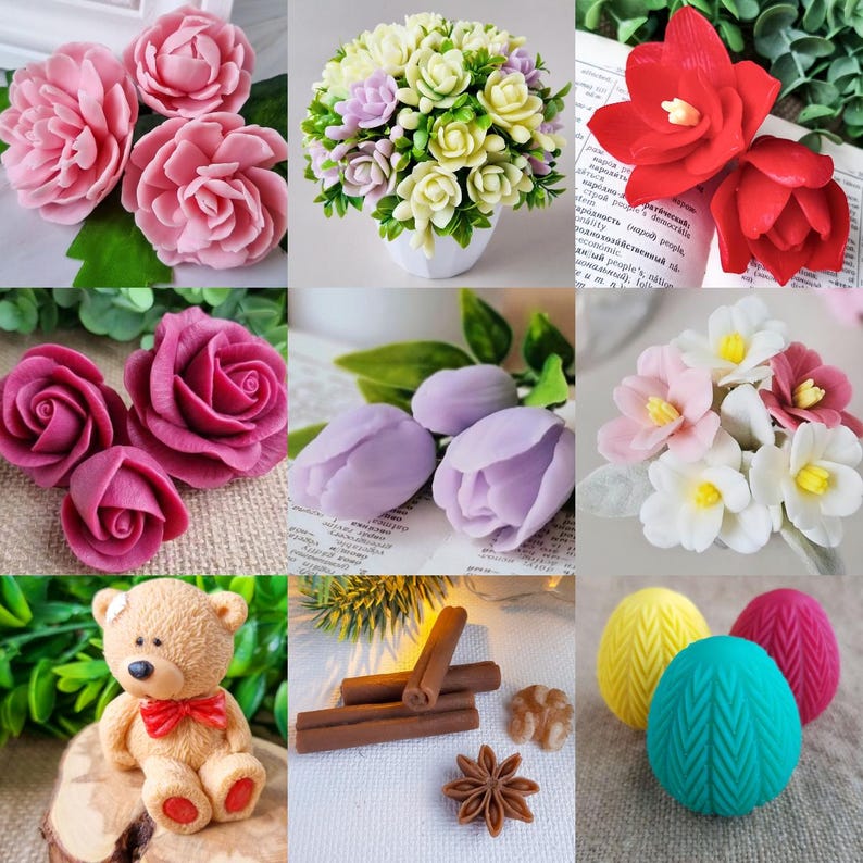 May include: A collection of handmade soaps shaped like flowers, including pink roses, red blooms, and a bouquet of white and purple flowers. Also featured are a teddy bear, cinnamon sticks, and decorative eggs.
